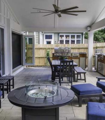 outdoor patio with seating and ceiling fan